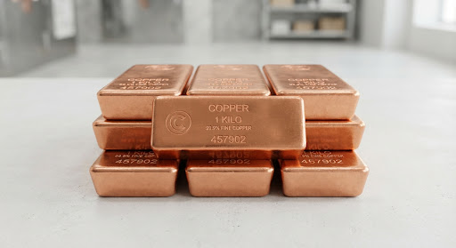 Stacked, polished copper bullion bars in a bright, minimalist industrial setting